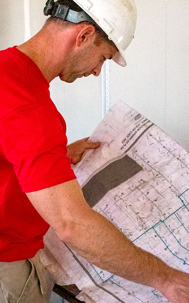 AFPI foreman reviewing plans